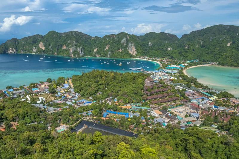 Stunning aerial view of the Phi Phi Islands with clear blue waters, a must-see destination on a Phi 