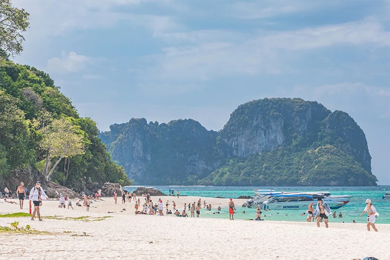 A relaxing beach on Bamboo Island in Phi Phi Islands, with soft sand and clear waters perfect for re