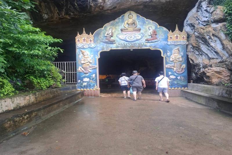 Explore the serene Buddha cave temple in Thailand, where spiritual history and natural beauty come t
