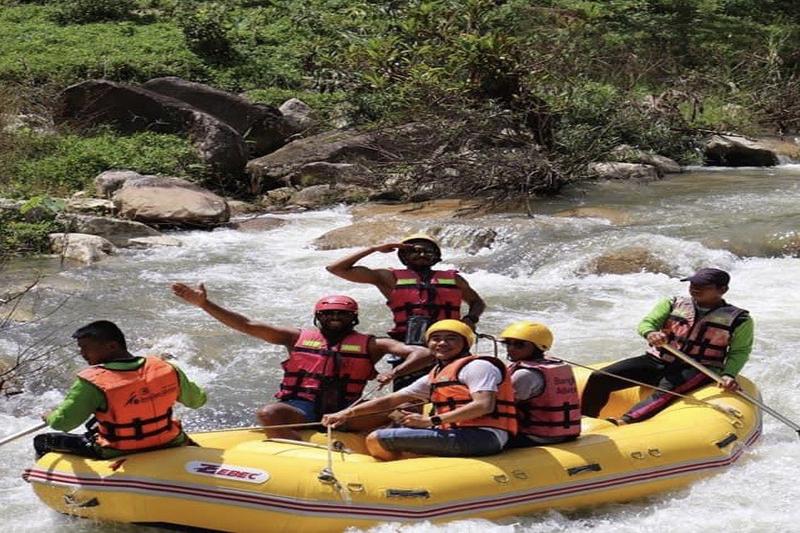 A thrilling rafting experience on a river, navigating through the exciting rapids.