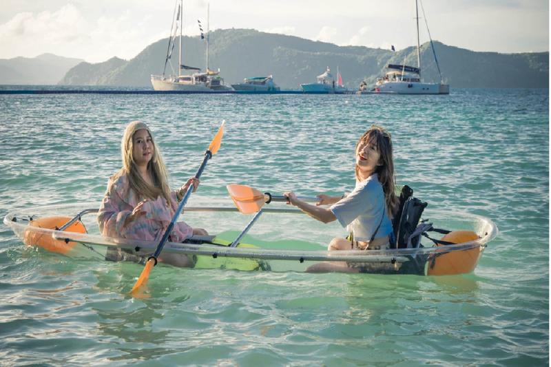 Kayaking with friends on a beautiful day, surrounded by crystal-clear waters.