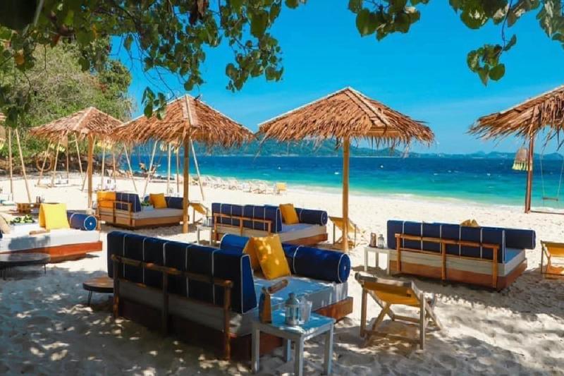 Unwind in luxurious beachfront lounges, perfect for a tropical getaway.