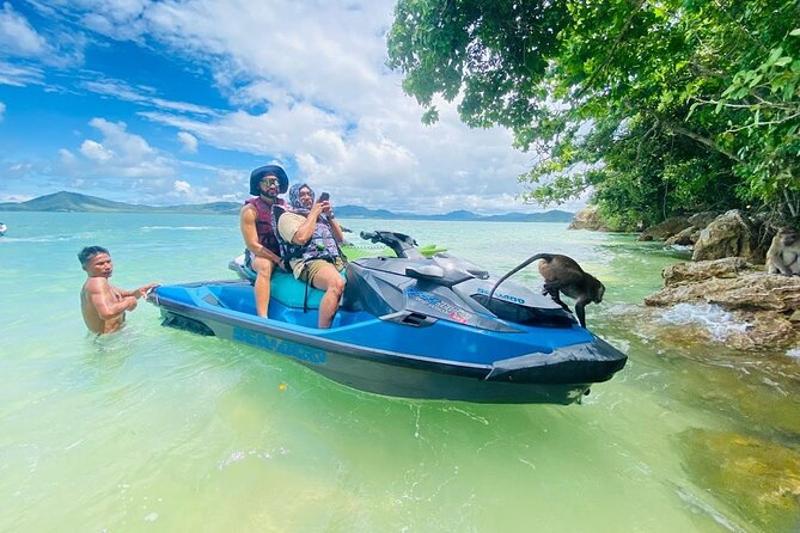 Experience the fun of riding jetskis with friends on the clear waters of Phuket Island.