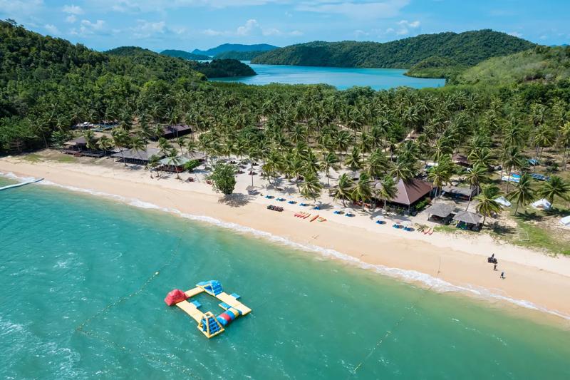 Kayaking through the clear waters near James Bond Island in Phuket, Thailand.