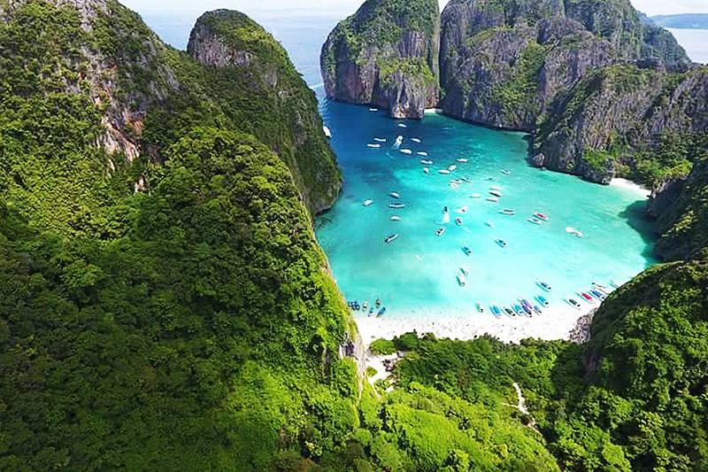 Aerial view of Phi Phi Islands with clear turquoise water and lush green landscapes.