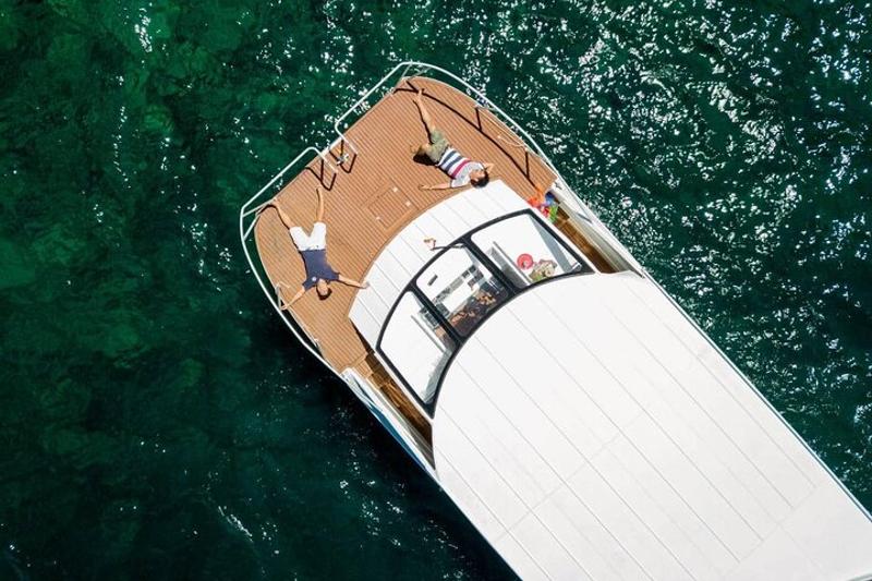 Maya Bay on Phi Phi Islands, with white sand and crystal-clear water framed by towering cliffs and l