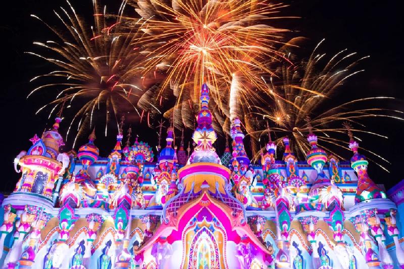 Beautifully decorated theater stage with colorful lights and vibrant set design.