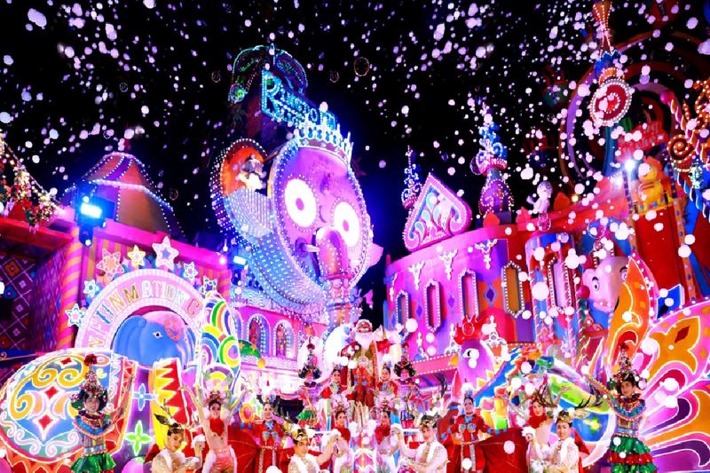 Colorful night parade with vibrant lights, performers, and a festive atmosphere.